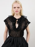 The Este ruffle top in black