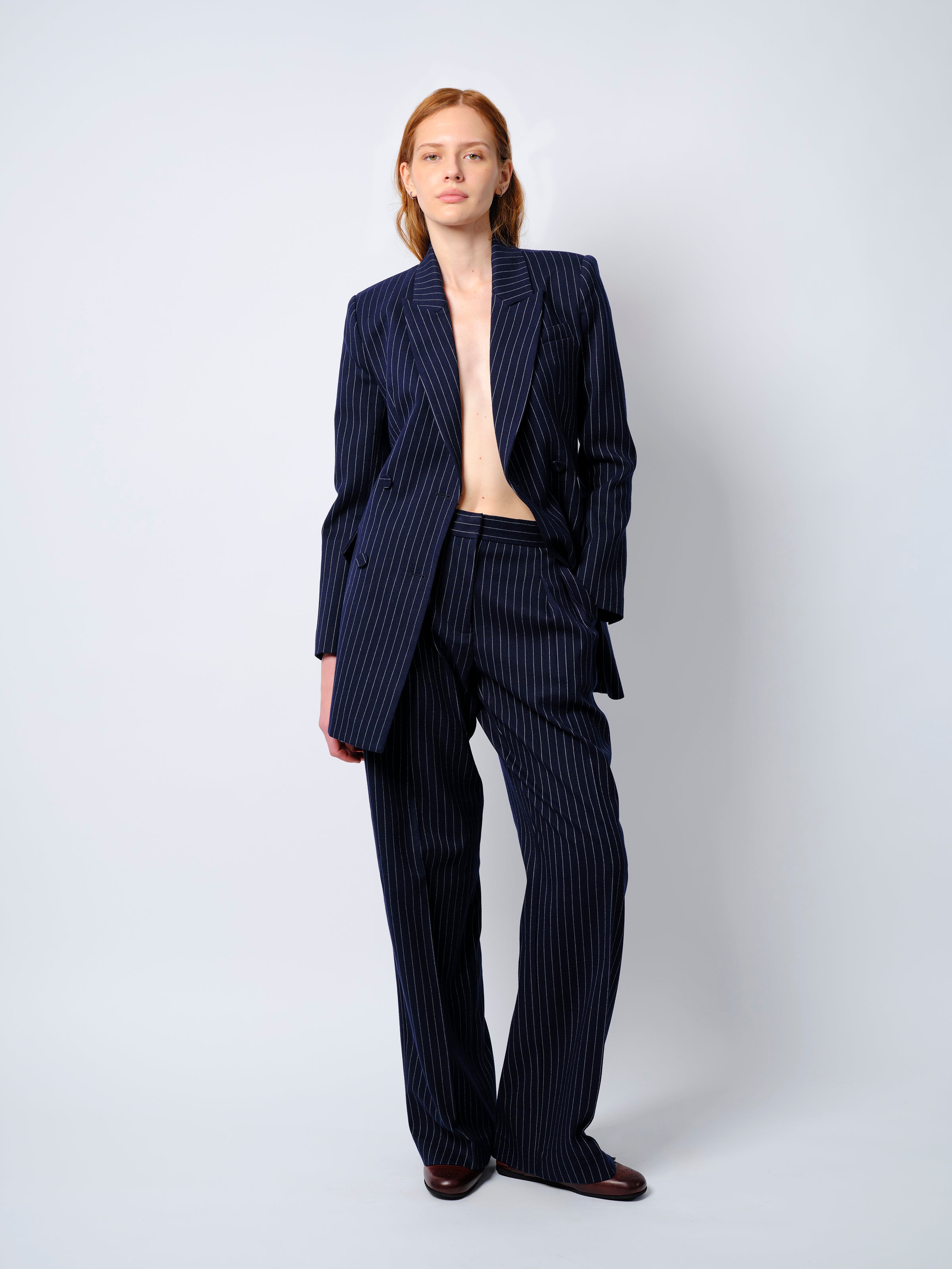 The Rune trousers in navy pinstripe