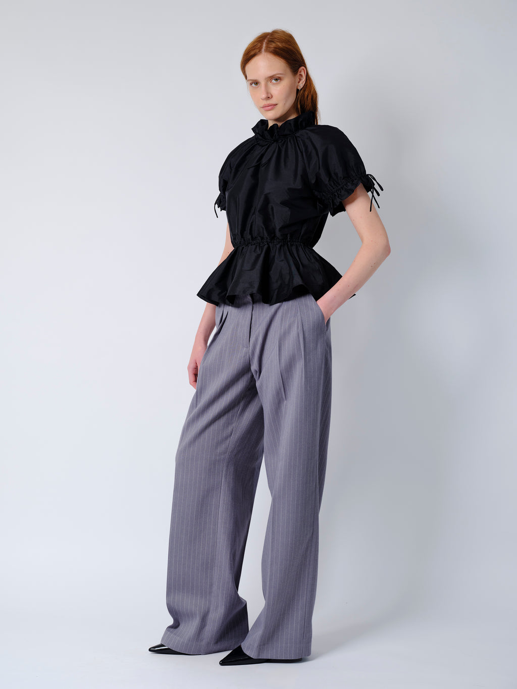 The Rune trousers in grey pinstripe