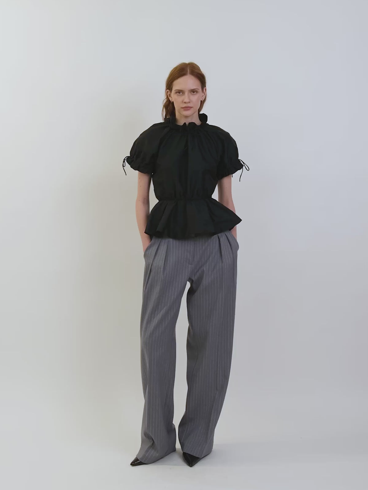 The Rune trousers in grey pinstripe